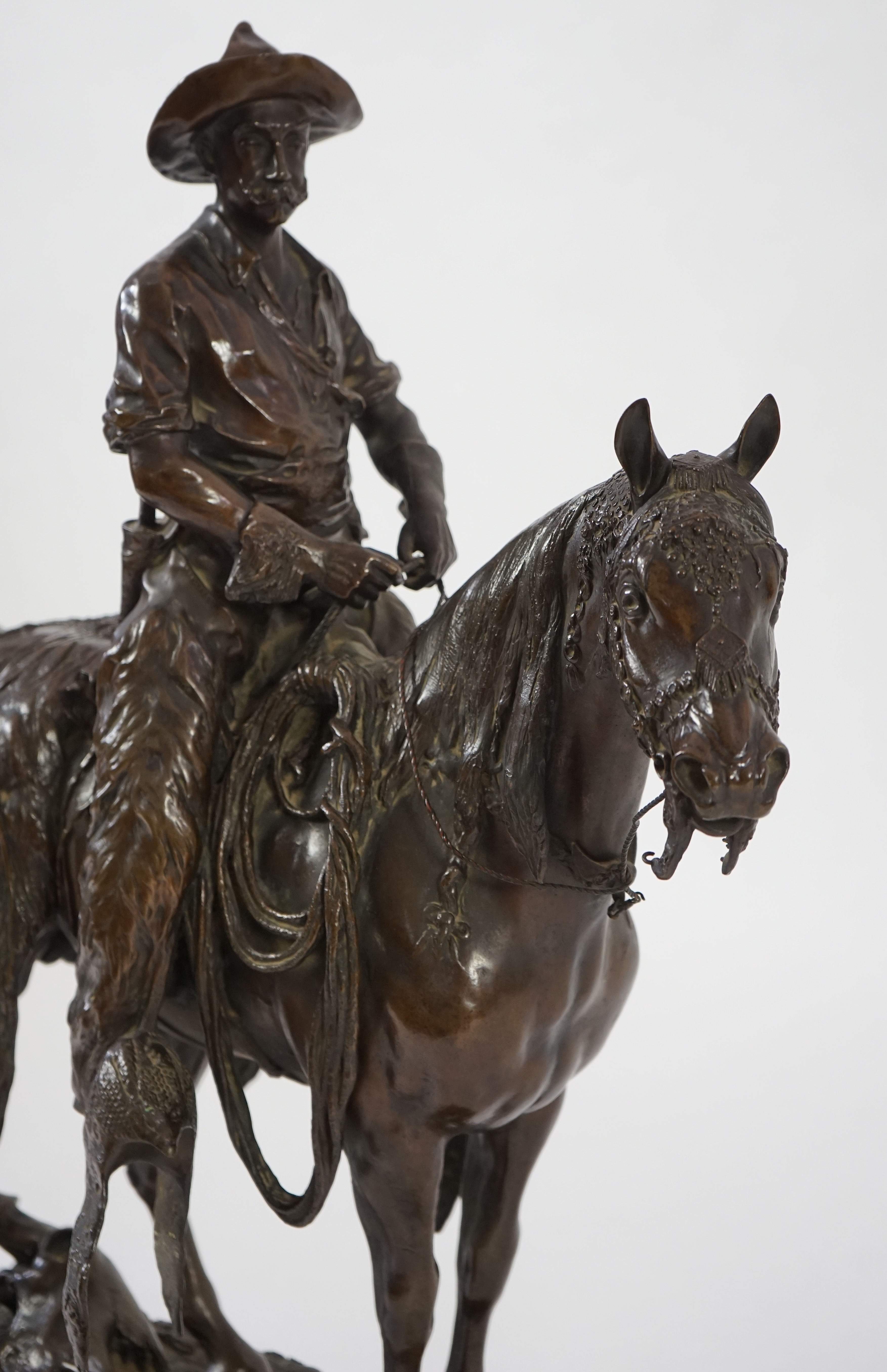 Walter Winans (St. Petersburg, 1852-Parsloe Park, Essex, 1920), a cast bronze of the artist, as a cowboy, riding the Arab stallion Skowronek, 50cm wide, 66cm high, overall 79.5cm high